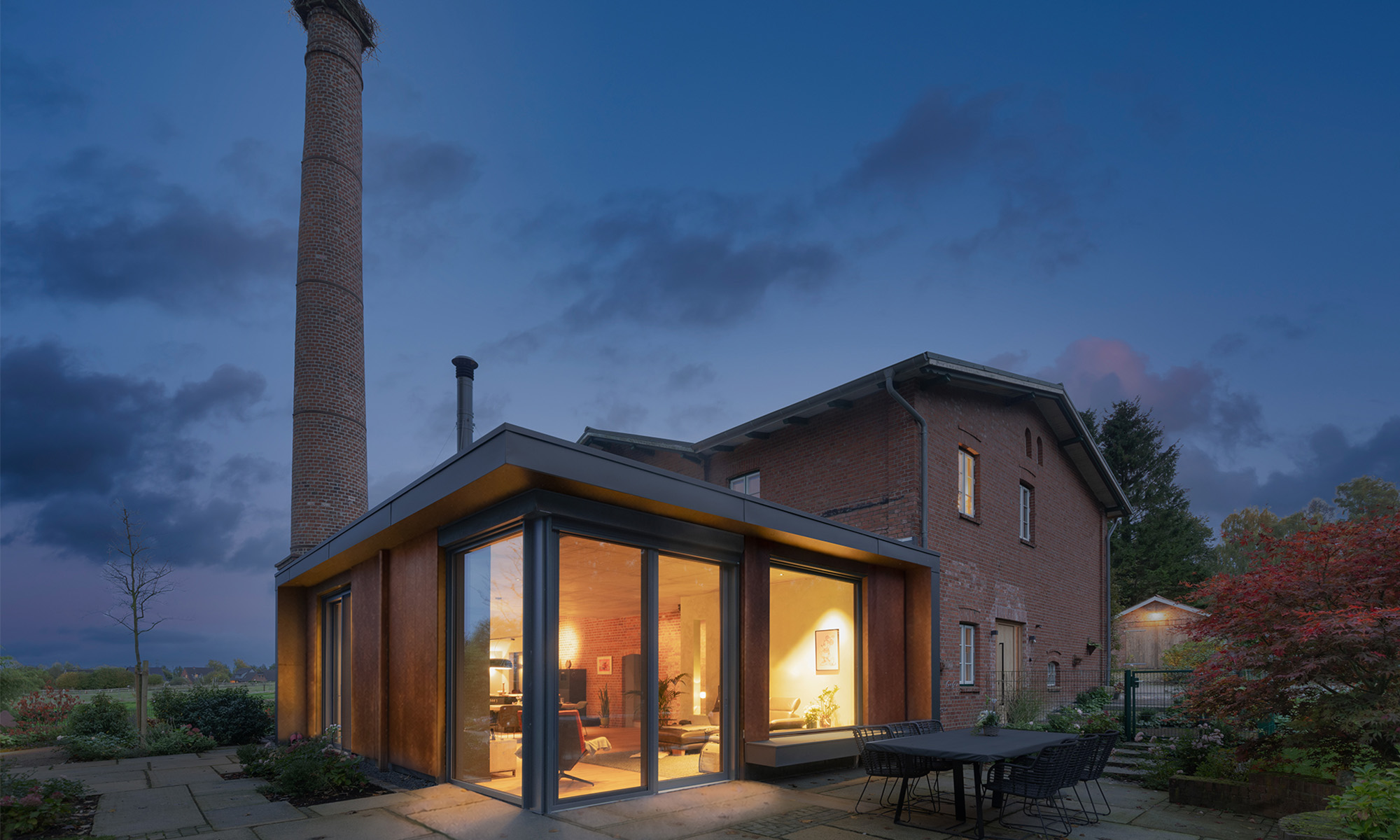 Anbau Fensterfront Backstein Terrasse Wohnbereich nachher